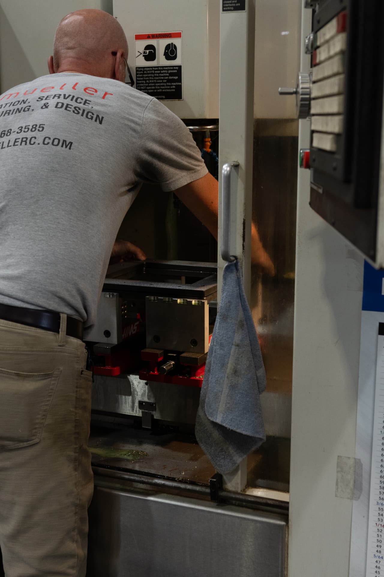 Mueller technician servicing industrial machinery