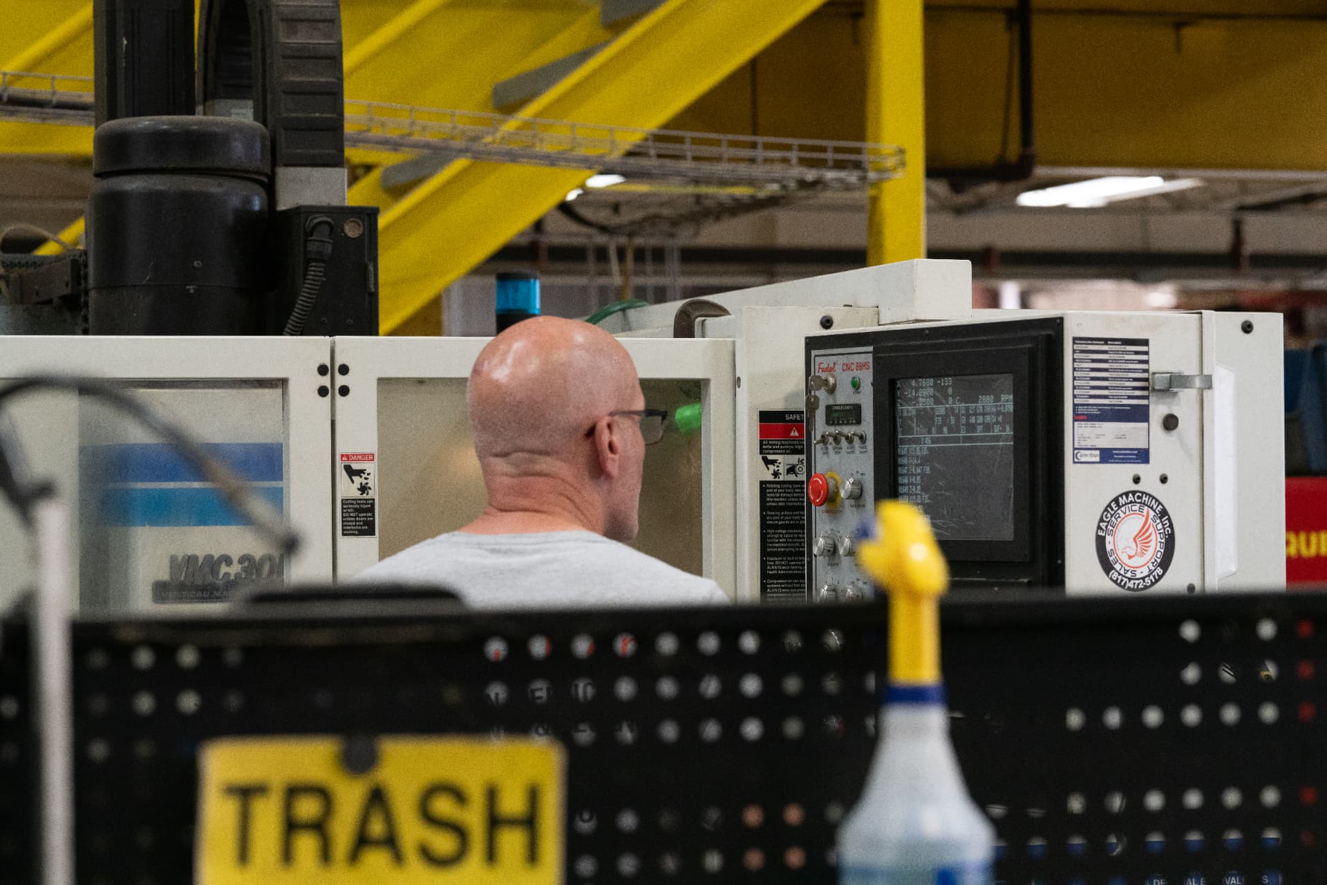 Machine operator running a CNC machining center